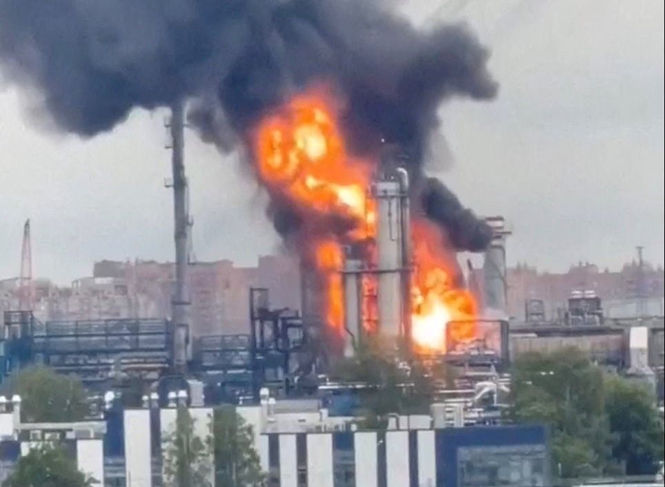 A screen grab of a video taken on a cell phone shows part of a Moscow refinery engulfed in flames.